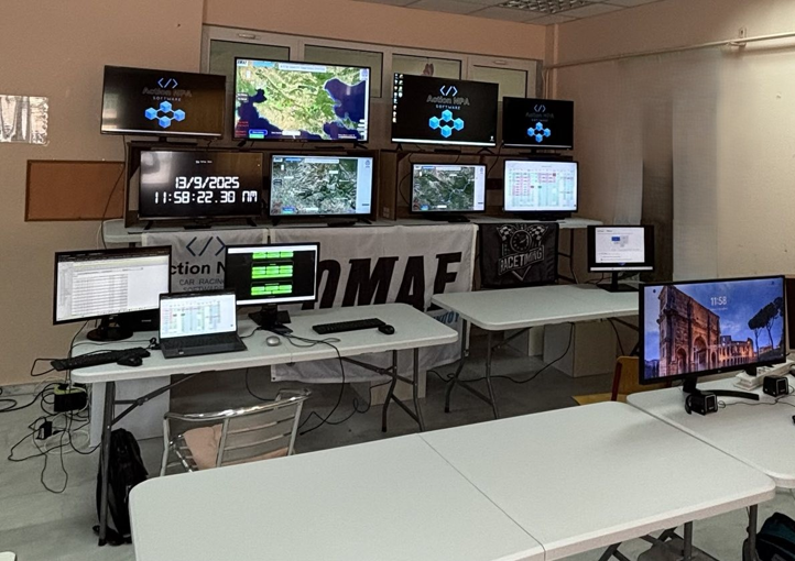 OMAE rally event command center with 8+ screens showing live timing and GPS tracking